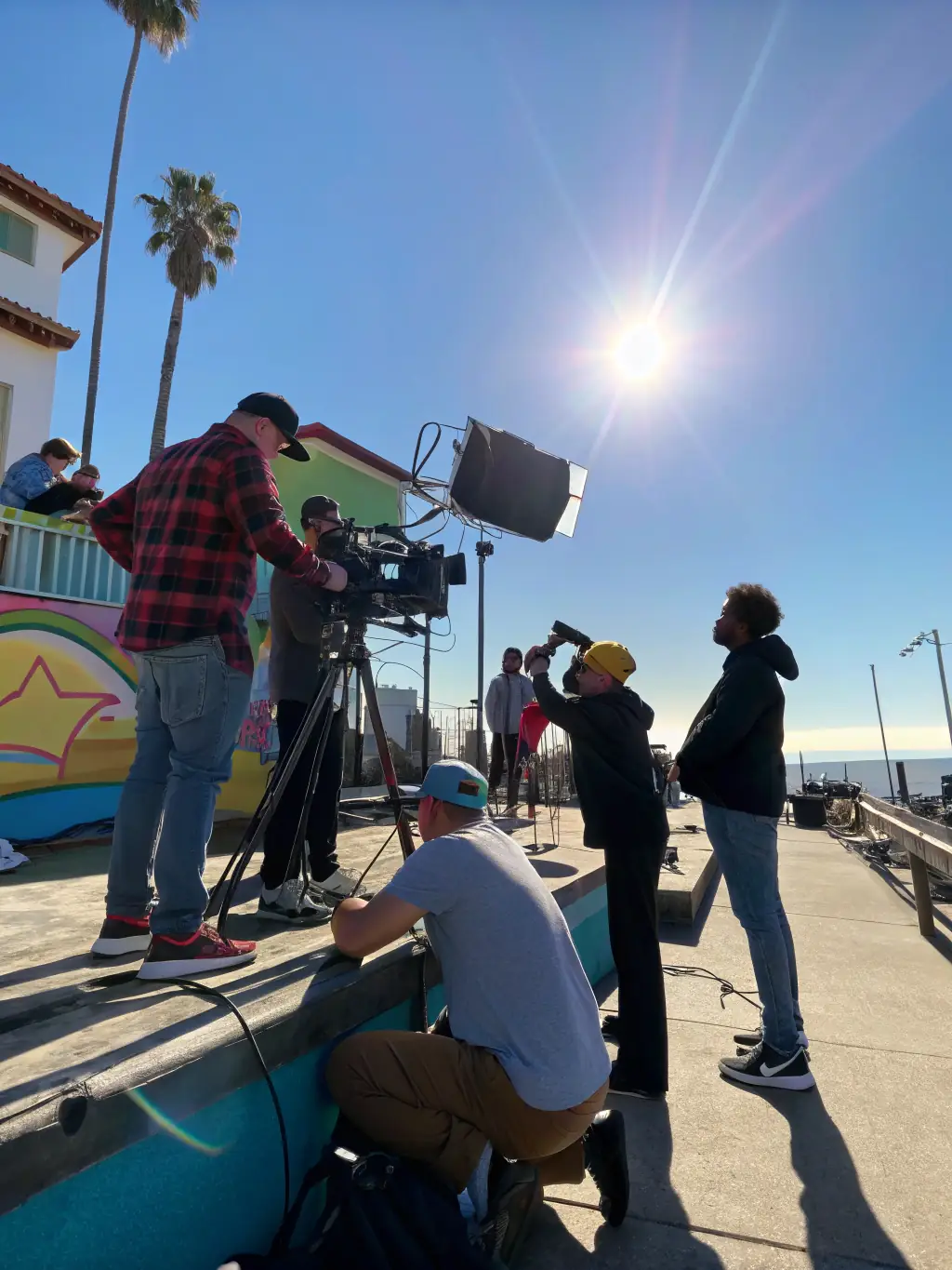 A film crew shooting a scene outdoors, highlighting the audiovisual program's focus on cinematic arts.